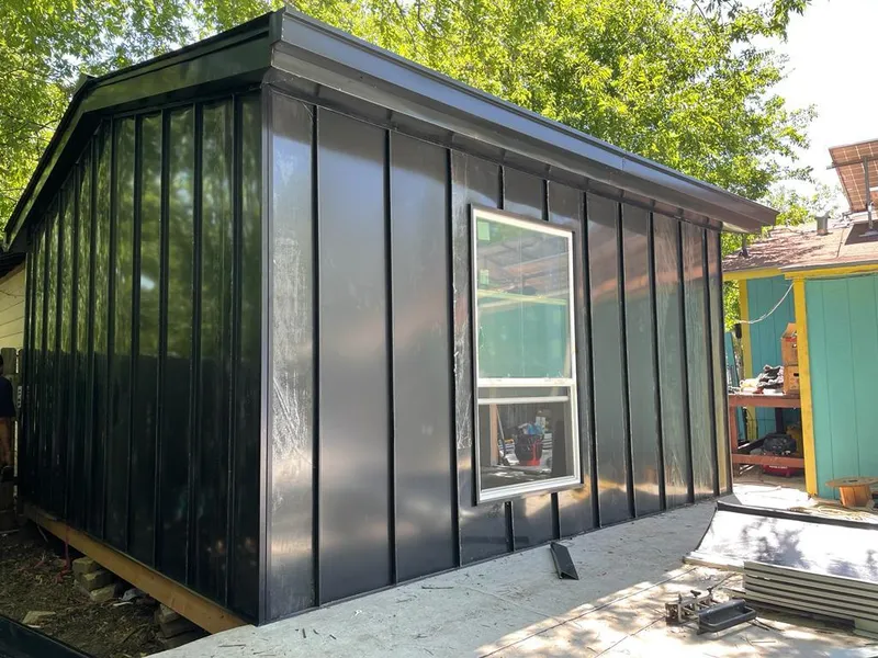 Black standing seam metal wall panels for Roof Inspection in Granbury